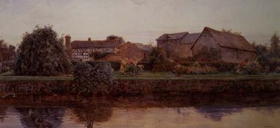 Une maison et des bâtiments de ferme au bord d