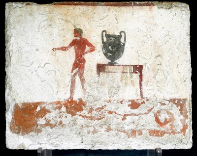 Art étrusque : un jeune éphèbe nu près d