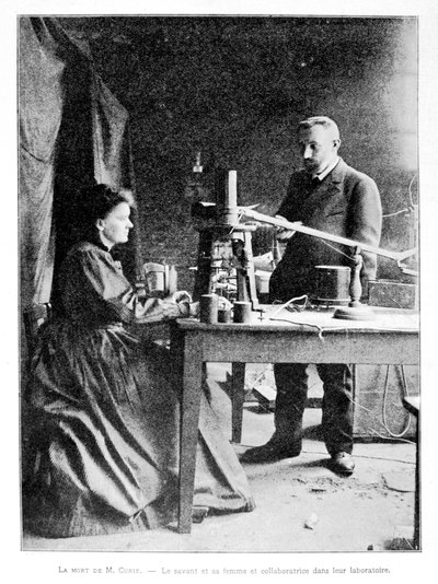 Pierre (1859-1906) et Marie (1867-1934) Curie dans leur laboratoire - French School