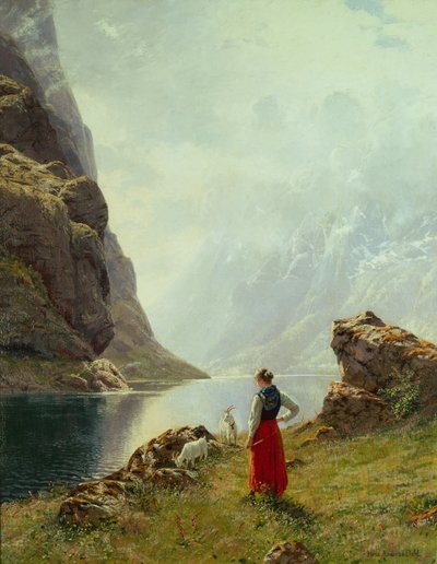 Une fille avec des chèvres près d