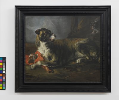 Un chien de chasse avec un morceau de viande près d