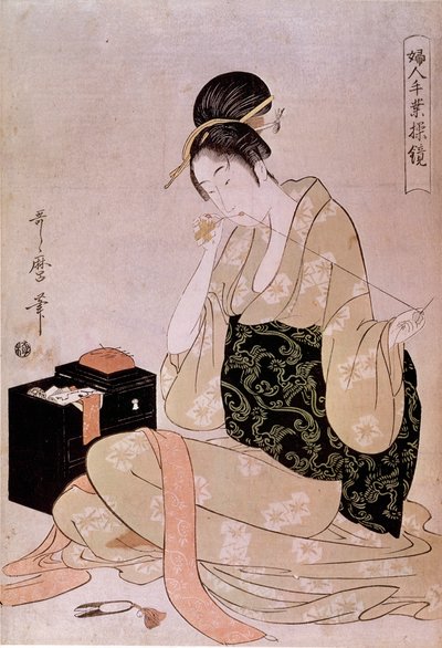 Couture, série de travaux manuels féminins : une couturière coupant du fil avec ses dents. Estampe japonaise par Utamaro Kitagawa (1753-1806). Dim. 0,37x0,26 m. XVIIIe siècle. Paris, Musée Guimet, Musée National des Arts Asiatiques - Kitagawa Utamaro