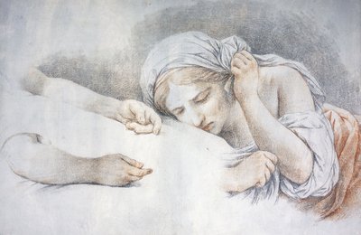 Une jeune fille reposant sa tête sur les genoux d