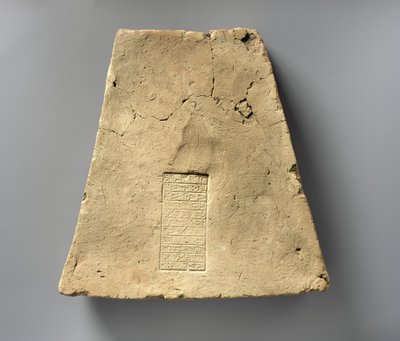 Brique avec inscription d