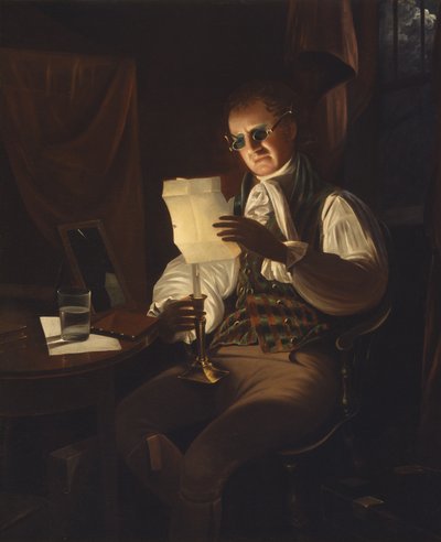 Homme lisant à la lumière d