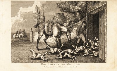 Chasseur ouvrant la porte du chenil pour laisser sortir les chiens avant d