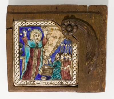 Un carreau de céramique syrien signé et daté, peint en manganèse, bleu et brun, daté 1699 - Syrian School