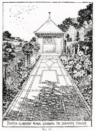 Promenade de jardin pavée menant à la maison d