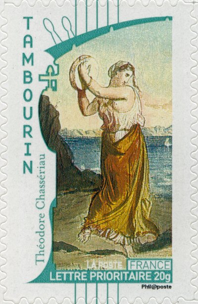 Timbre-poste français montrant une femme gitane jouant du tambourin, d