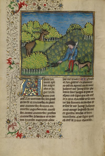 Un chasseur et un chien examinant la trace d