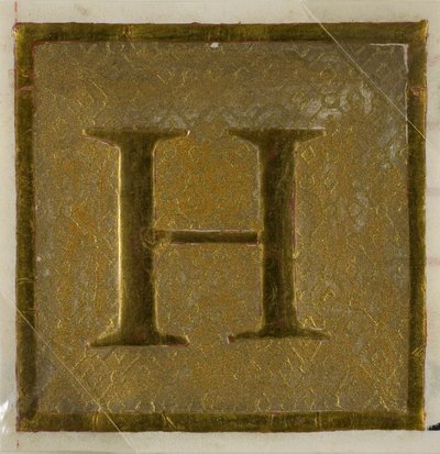 Initiale "H" enluminée dans un motif de couche provenant d