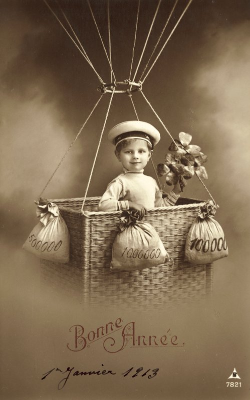 Carte de Nouvel An 1913, avec un garçon montant un ballon, avec beaucoup d