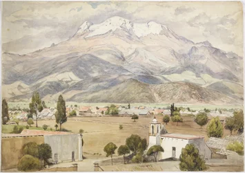 Village au premier plan et montagnes derrière