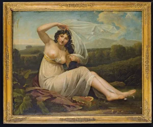 Jeune femme assise dans un paysage