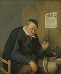 Vieil homme tenant un verre de vin