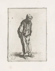Homme debout avec les mains dans le dos