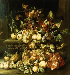 Raisins, figues, framboises et autres fruits sur un rebord en pierre