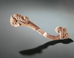 Pièce de joue décorée de têtes, nomade de l
