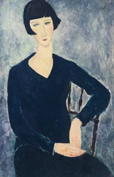 Jeune femme à frange ou jeune femme assise en robe bleue