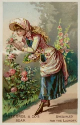 Fille sentant les roses