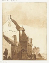 Maison avec brouette devant la porte