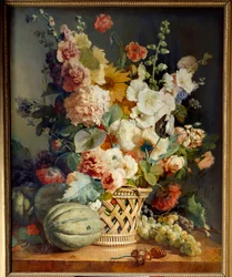 Fleurs et fruits dans un panier en osier