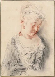 Femme assise regardant vers le bas