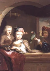 Trois enfants avec un perroquet