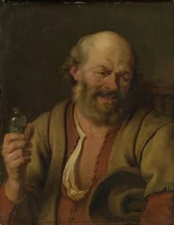 Un homme avec une bouteille de gin