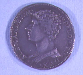 Pièce de monnaie décorée de la tête d