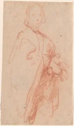 Un homme debout avec manteau et gants
