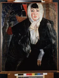 Portrait de femme. Belle femme au visage mélancolique, dans la rue, la tête couverte de son écharpe, vêtue d