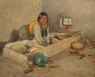 Femme Hopi qui moud le maïs