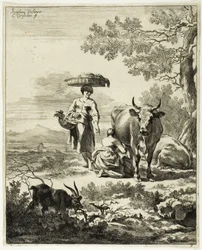 Femme trayant une vache