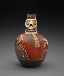Bouteille figurative avec masque mortuaire