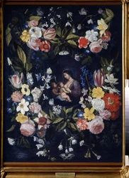 Couronne de fleurs avec la Vierge et l