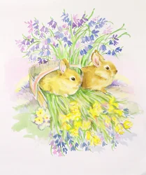 Lapins dans un panier avec des jonquilles et des jacinthes des bois