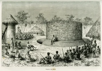 Réception chez Mkwewe, chef de tribu, avec le narrateur. Gravure de Riou pour illustrer le récit Les lacs de l