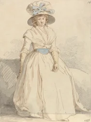 Jeune femme assise portant une robe blanche