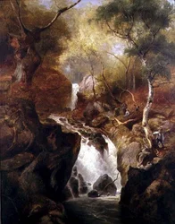 Cascade à travers une forêt