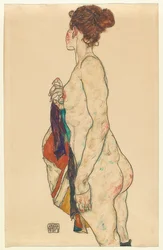 Nu debout avec robe à motifs