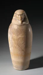 Vase canope avec tête d