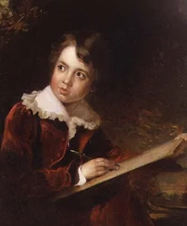 Jeune garçon écrivant