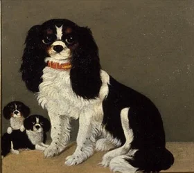 Un épagneul Cavalier King Charles avec des chiots