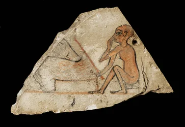 Ostracon représentant un garçon et un cochon ...