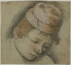 Tête de jeune homme avec un bonnet rose