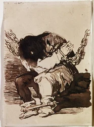 Prisonnier enchaîné assis