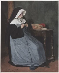 Une nonne assise à une table en train de tricoter