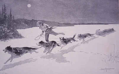 Trappeur français au Canada avec des chiens Huskie sur un lac gelé