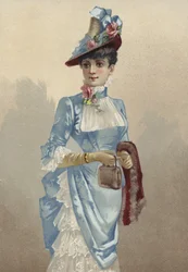 Jeune femme élégante en robe bleue, portant un petit sac à main